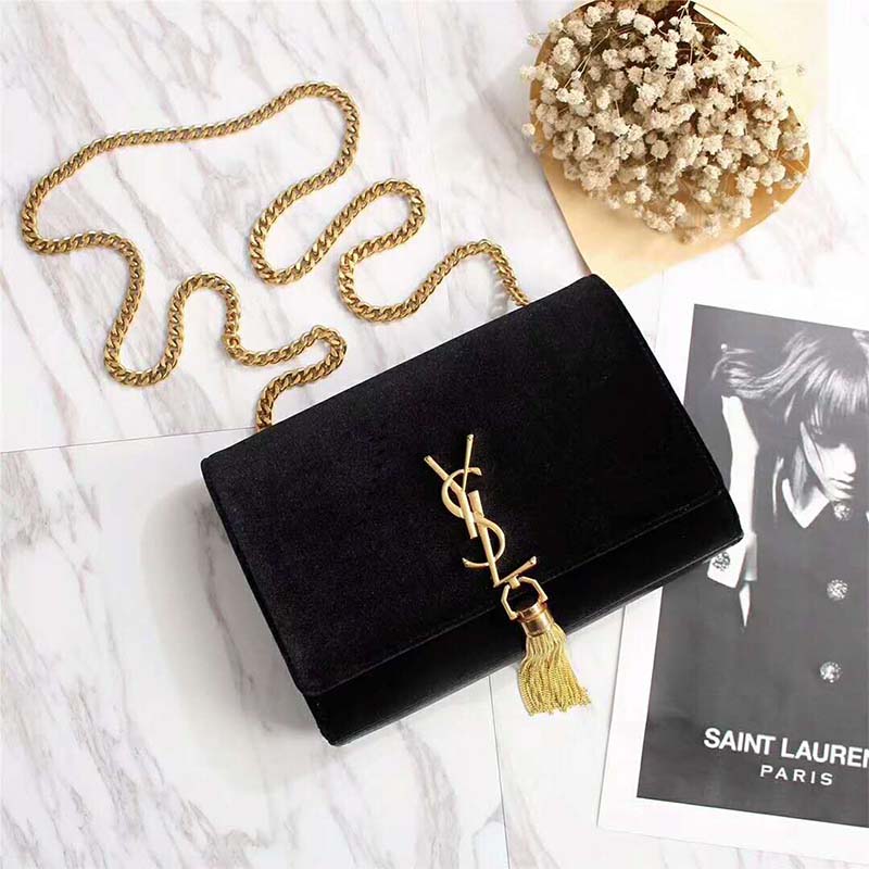 Close-up of gold YSL logo and tassel on Velvet-Black Kate Small bag