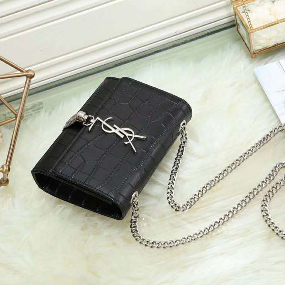 Side angle showing croc-embossed texture and silhouette of wallet
