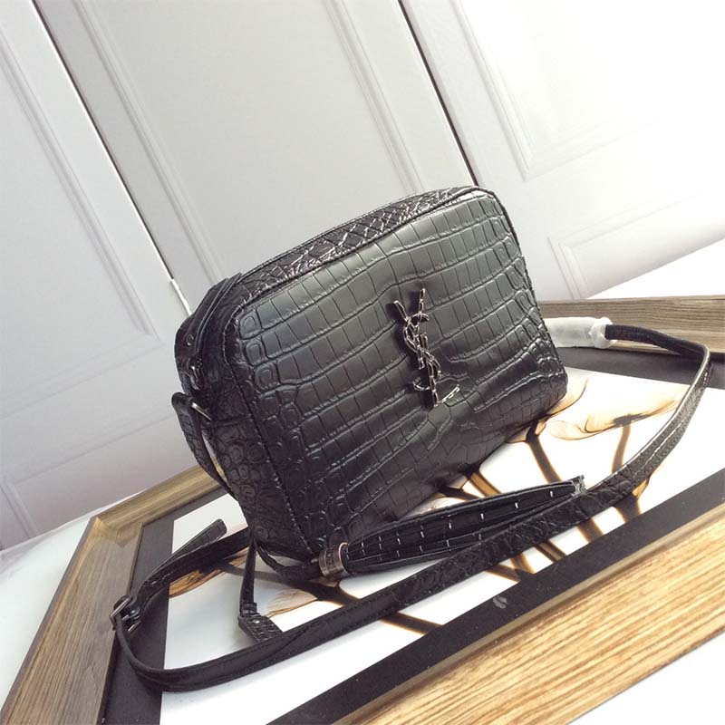 Close-up of gold YSL clasp on Lou Camera Bag in black leather