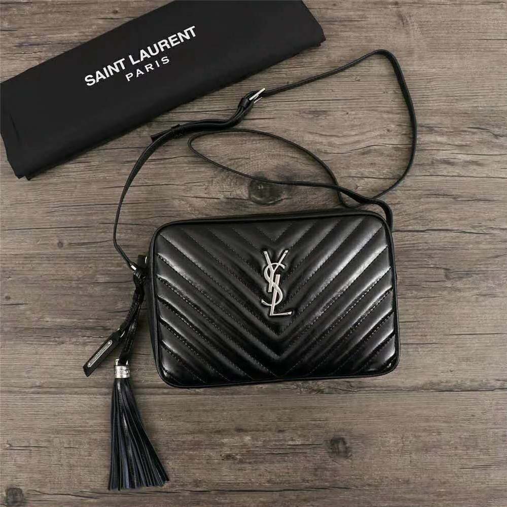 Close-up of silver YSL logo on Saint Laurent YSL Women Lou Camera Bag