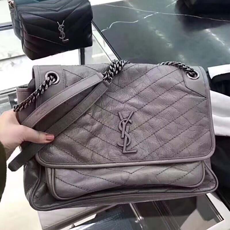 Side angle showing the crinkled leather texture of Saint Laurent Niki Chain bag