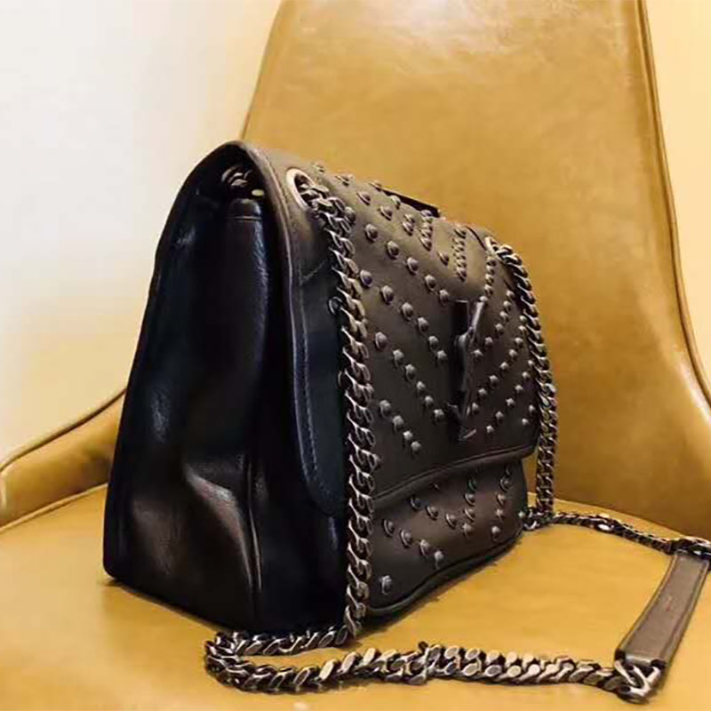 Side angle showing silhouette and shoulder strap of Saint Laurent YSL Niki bag