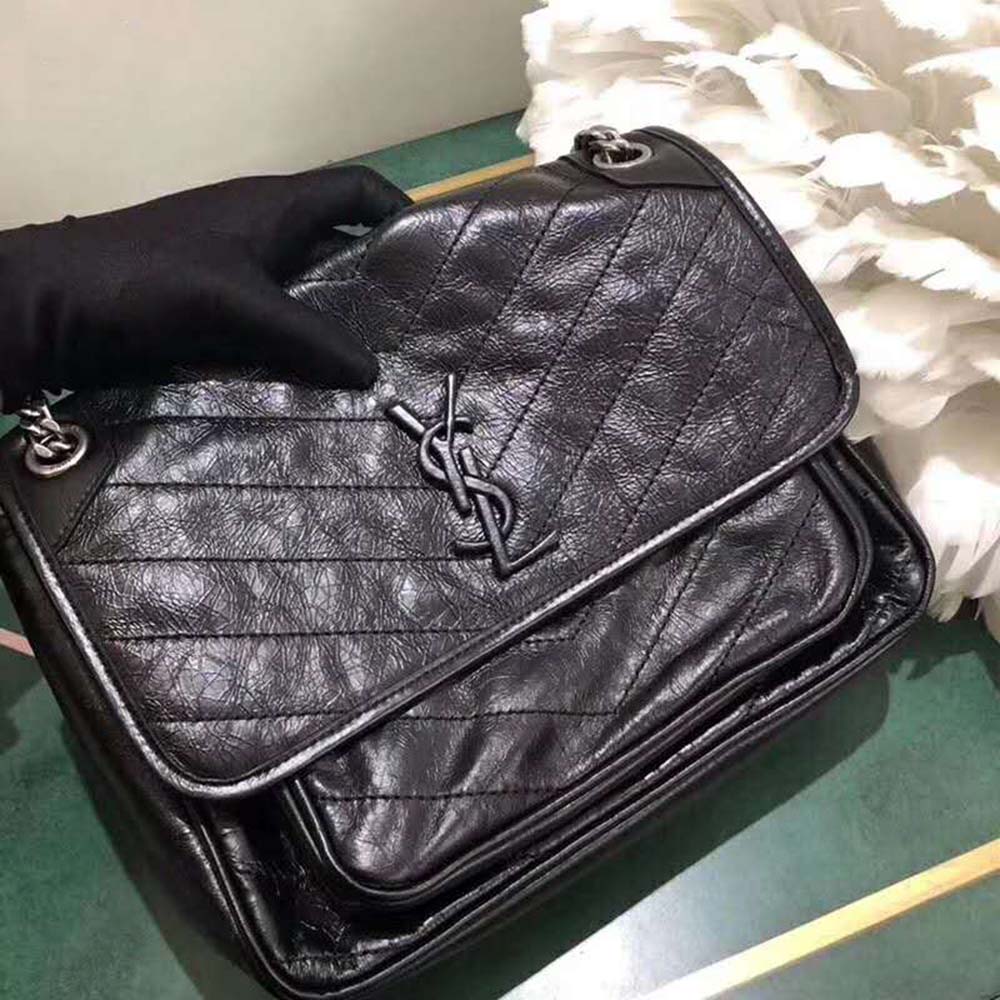 Side profile showcasing silhouette of Saint Laurent YSL Women Niki Medium bag