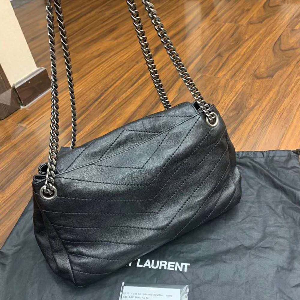 Side profile showing structured silhouette of Saint Laurent Nolita Medium Bag
