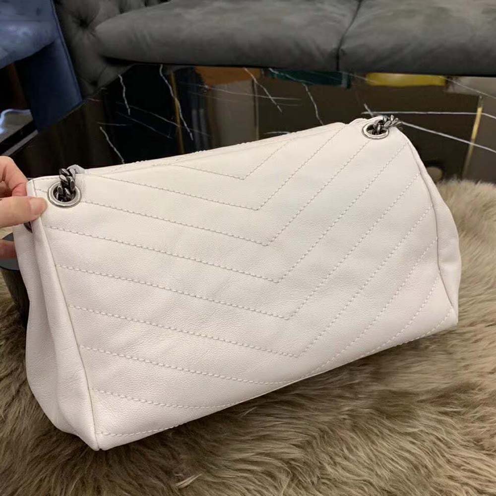 Side angle showing adjustable shoulder strap of Saint Laurent YSL Nolita bag