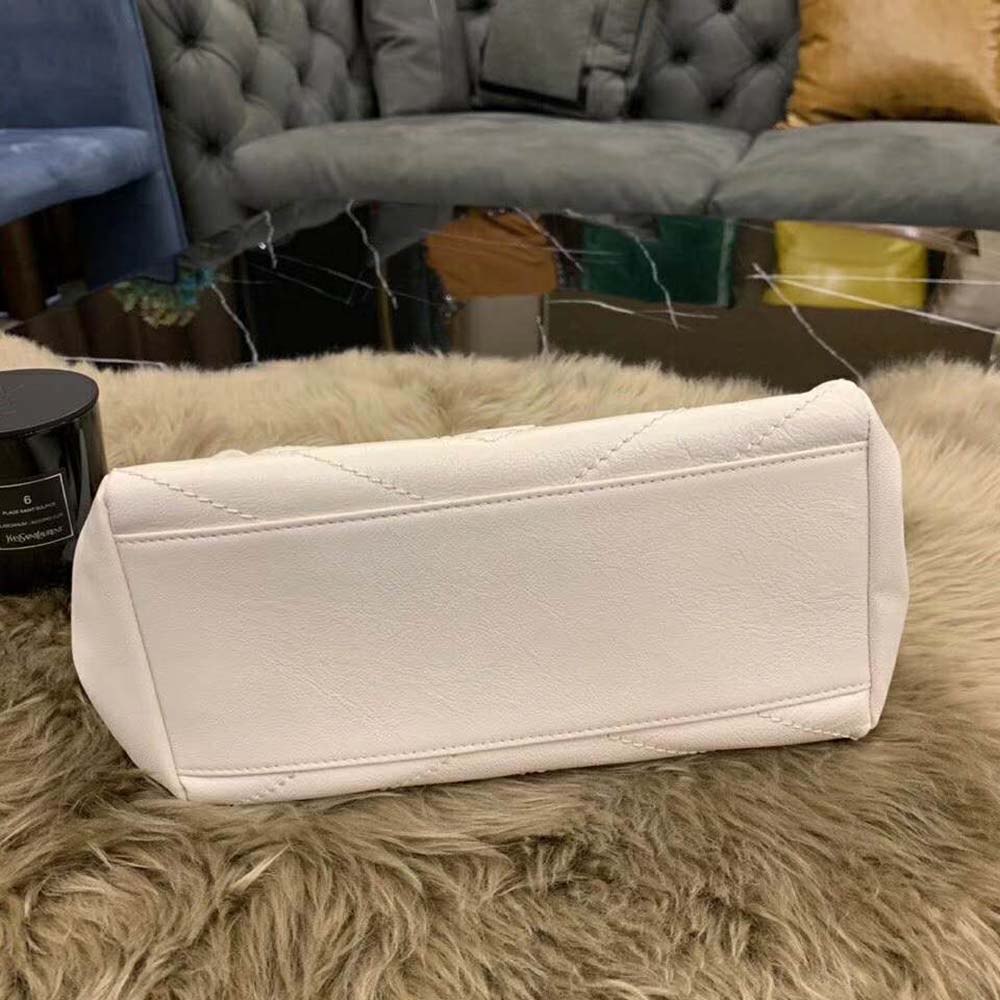 Side profile showing slim silhouette of Saint Laurent YSL Nolita Small Bag