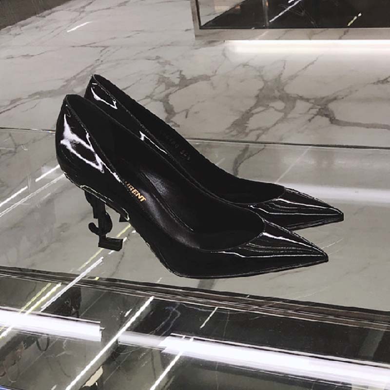 Close-up on gold YSL logo heel detail of Saint Laurent YSL Women Opyum 110 Pump