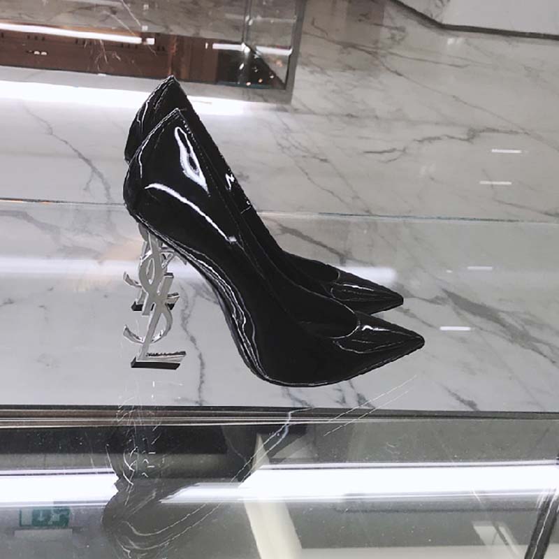 Close-up of silver YSL logo hardware on Saint Laurent YSL Women Opyum 110 Pump