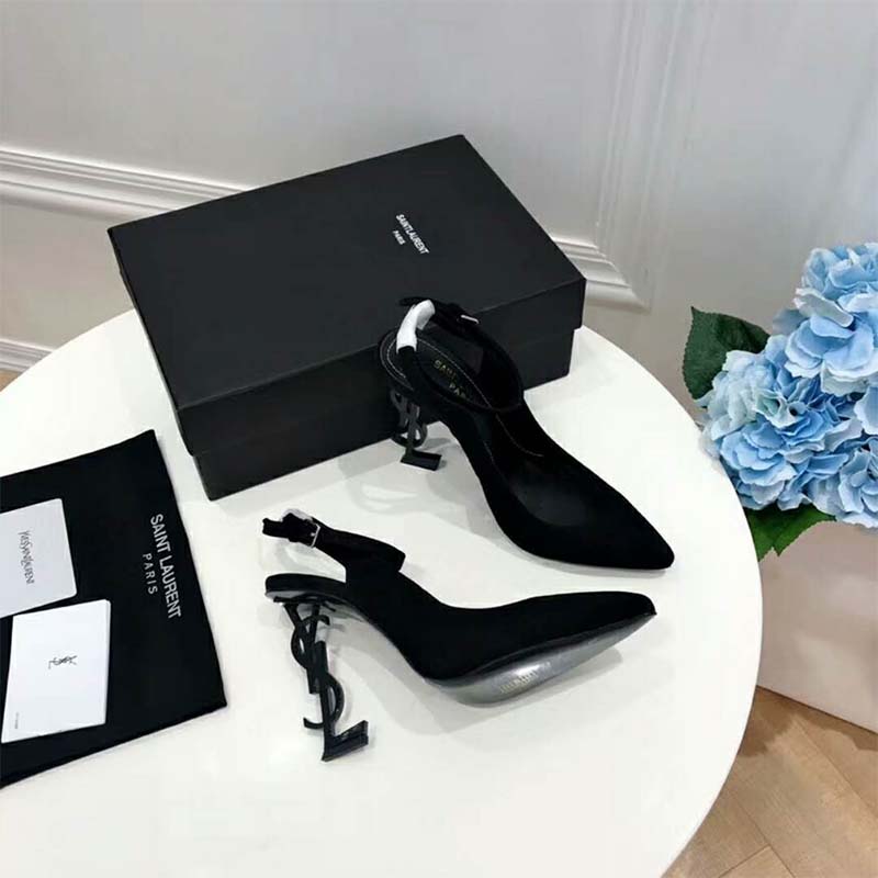 Close-up of gold YSL logo heel on Saint Laurent Women Opyum Pump