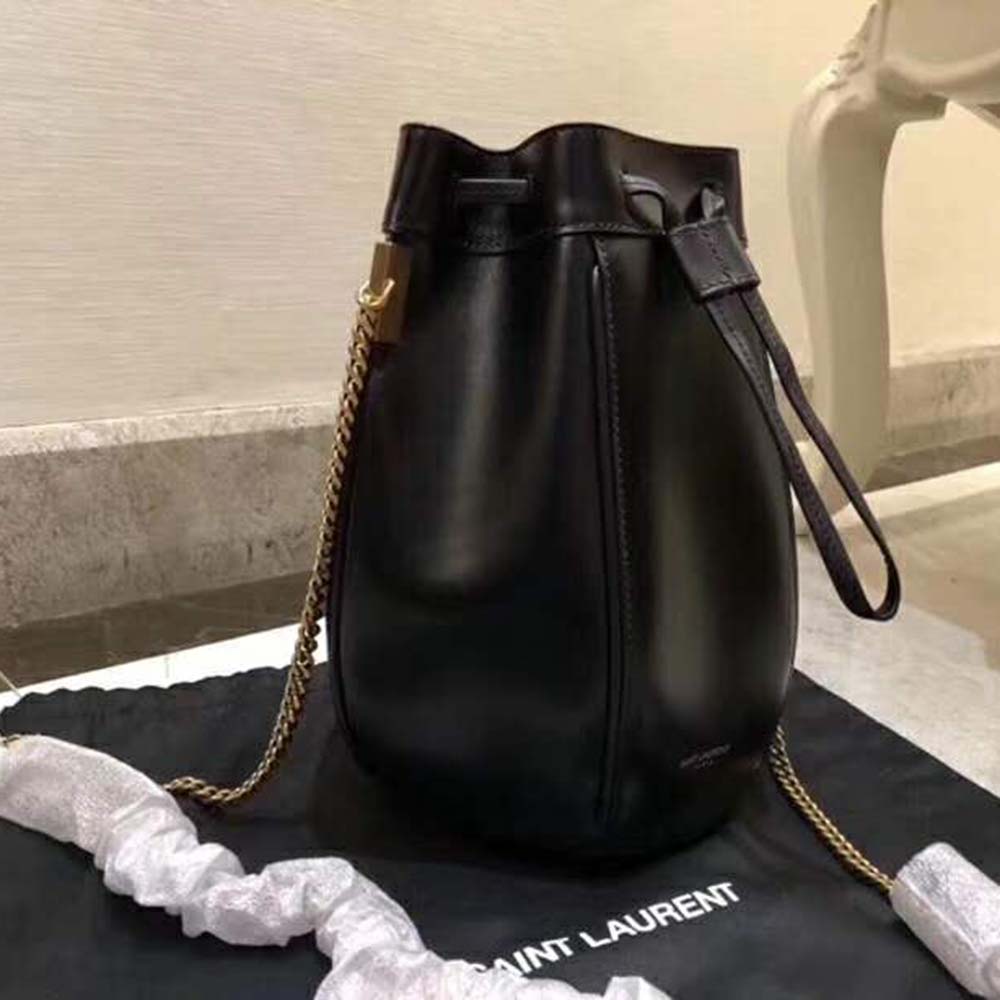 Side angle showing compact silhouette of Saint Laurent YSL mini shoulder bag