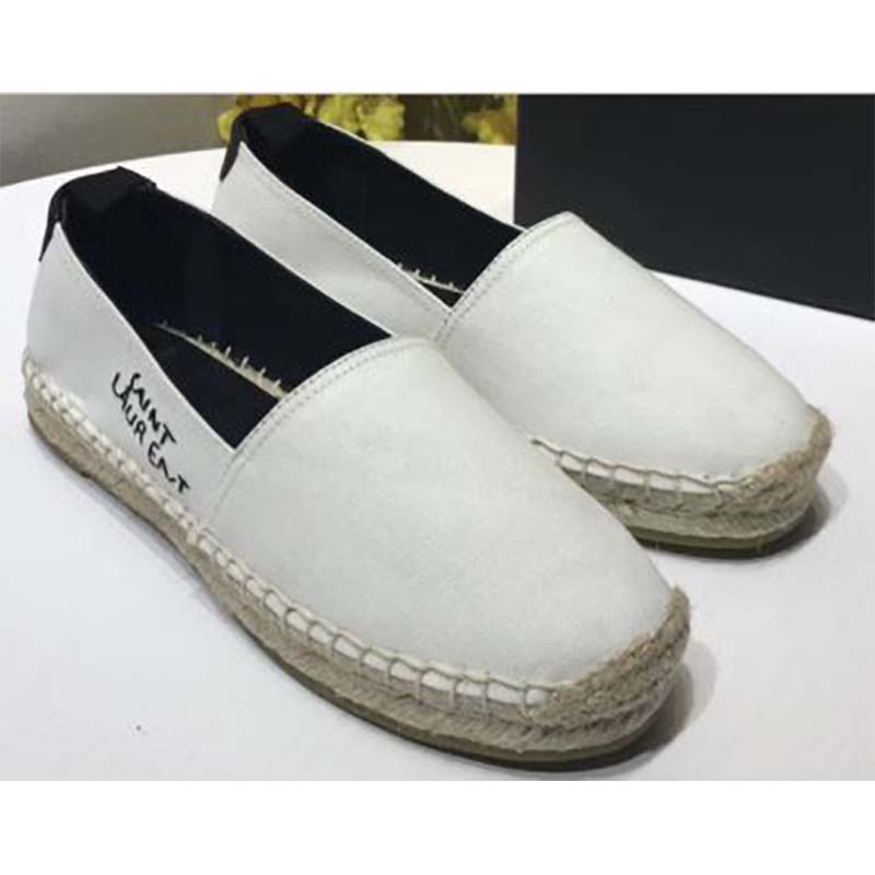 Close-up detail of YSL embroidered logo on cotton-white espadrille