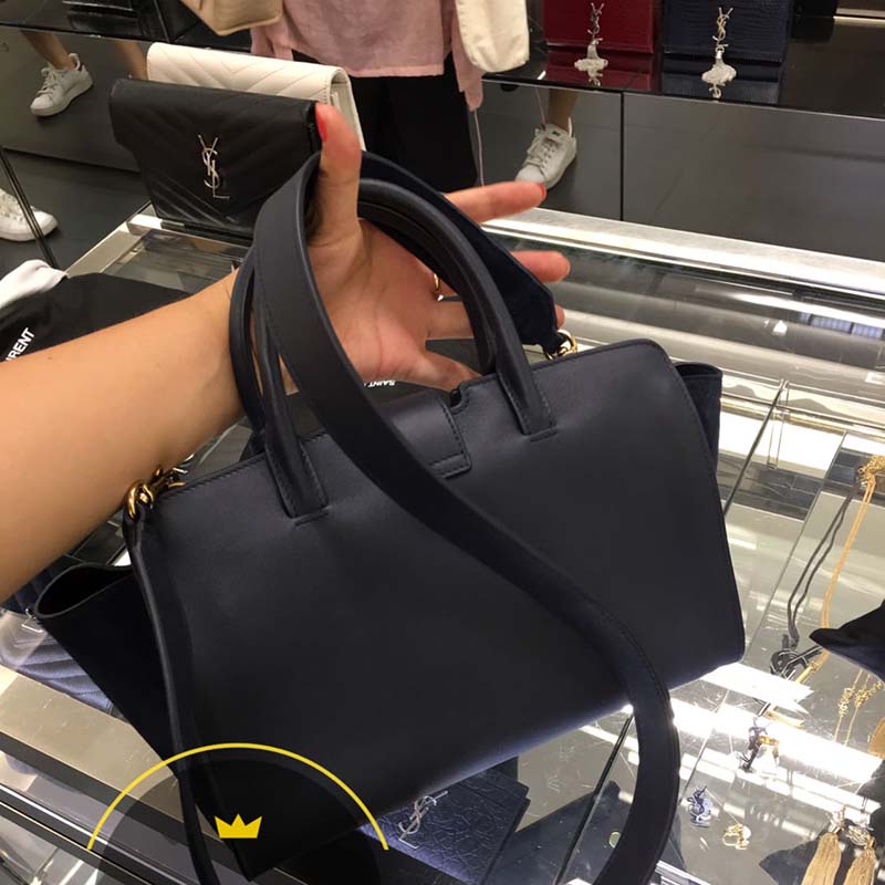 Side angle showing structured silhouette of Saint Laurent YSL Downtown Cabas bag