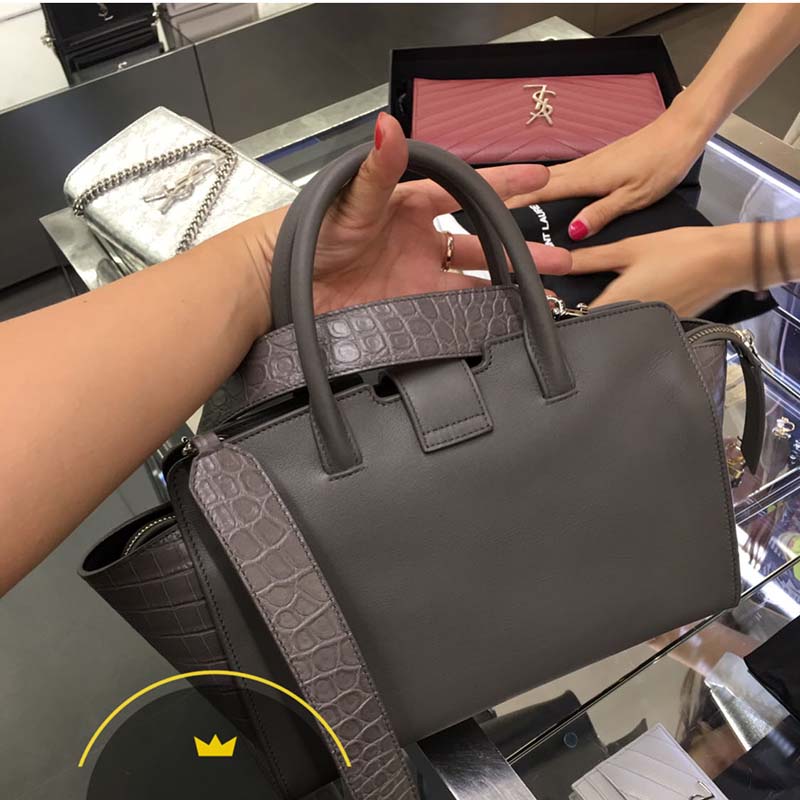 Side angle showing structured silhouette of Saint Laurent YSL Small Downtown Cabas Grey bag