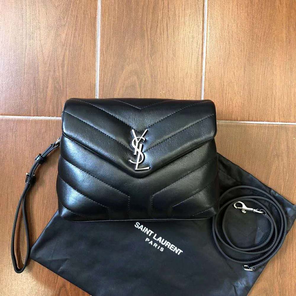 Close-up of gold YSL logo hardware on Small Loulou Bag Black leather