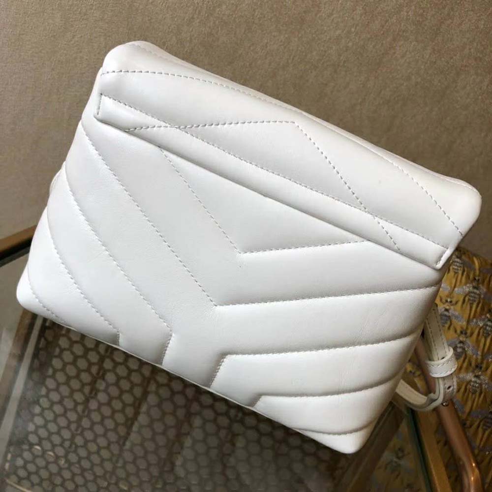 Side angle showing the adjustable strap and quilting detail of Loulou bag