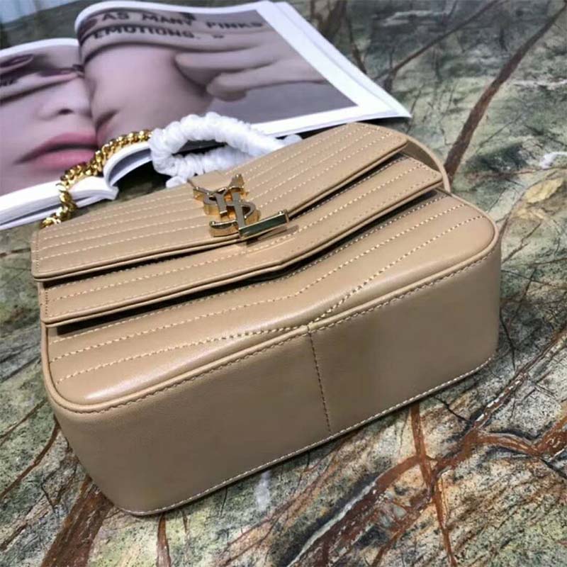 Close-up of gold YSL logo and matelasse leather detail on Sulpice Small