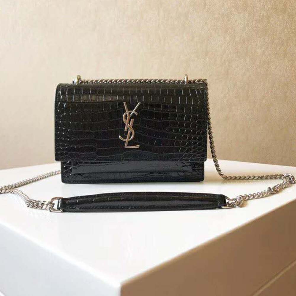 Close-up of gold YSL logo hardware on Saint Laurent YSL Women Sunset Small bag