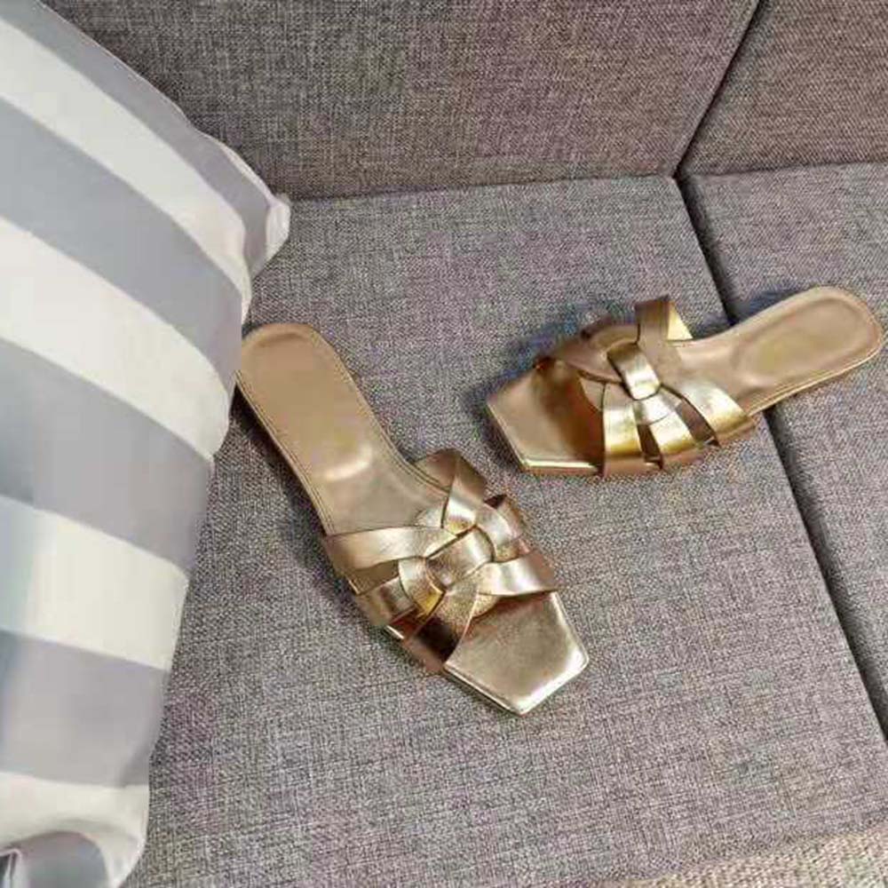 Top view showing metallic gold leather and slip-on silhouette sandals