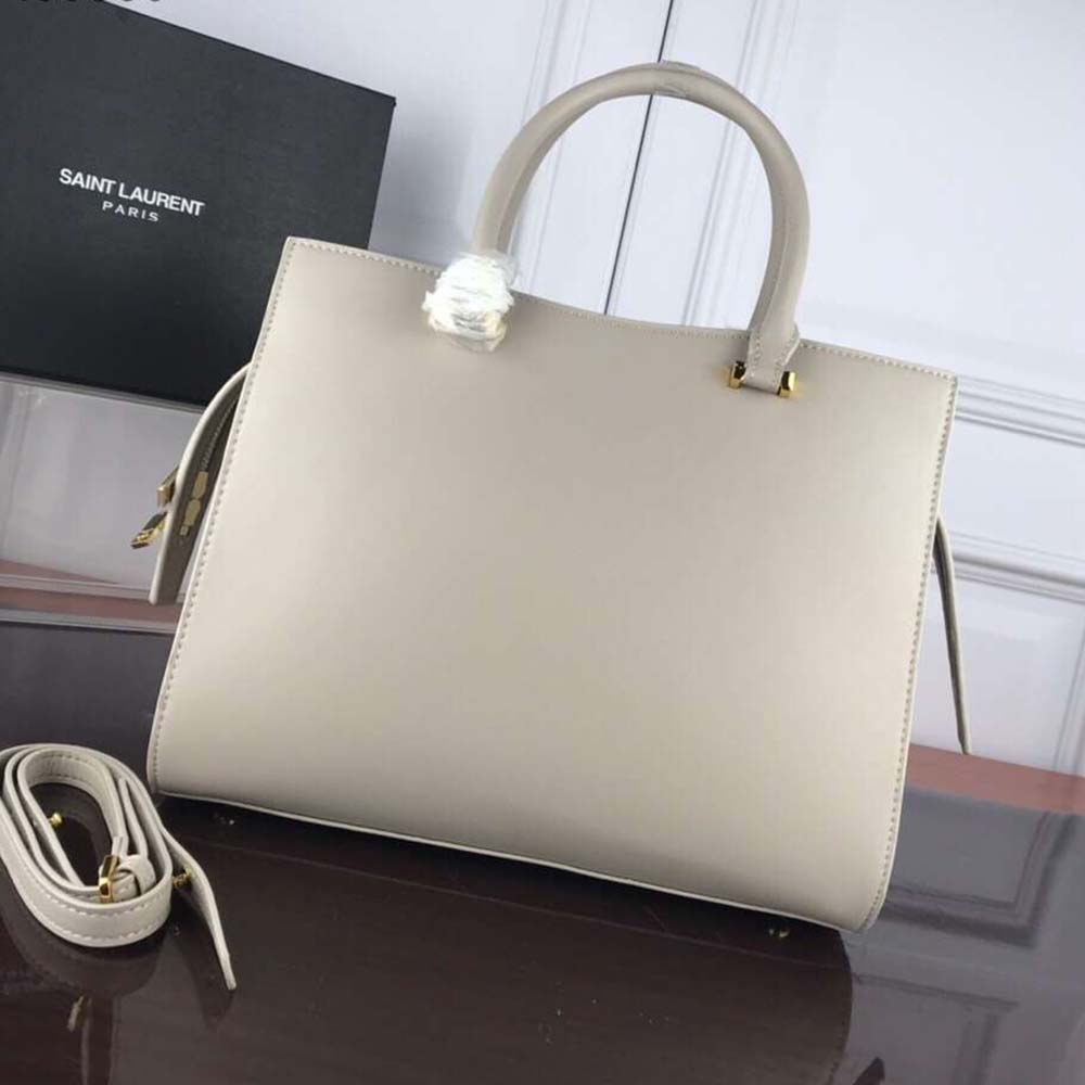 Side profile showing structured silhouette of Saint Laurent Uptown Medium Tote