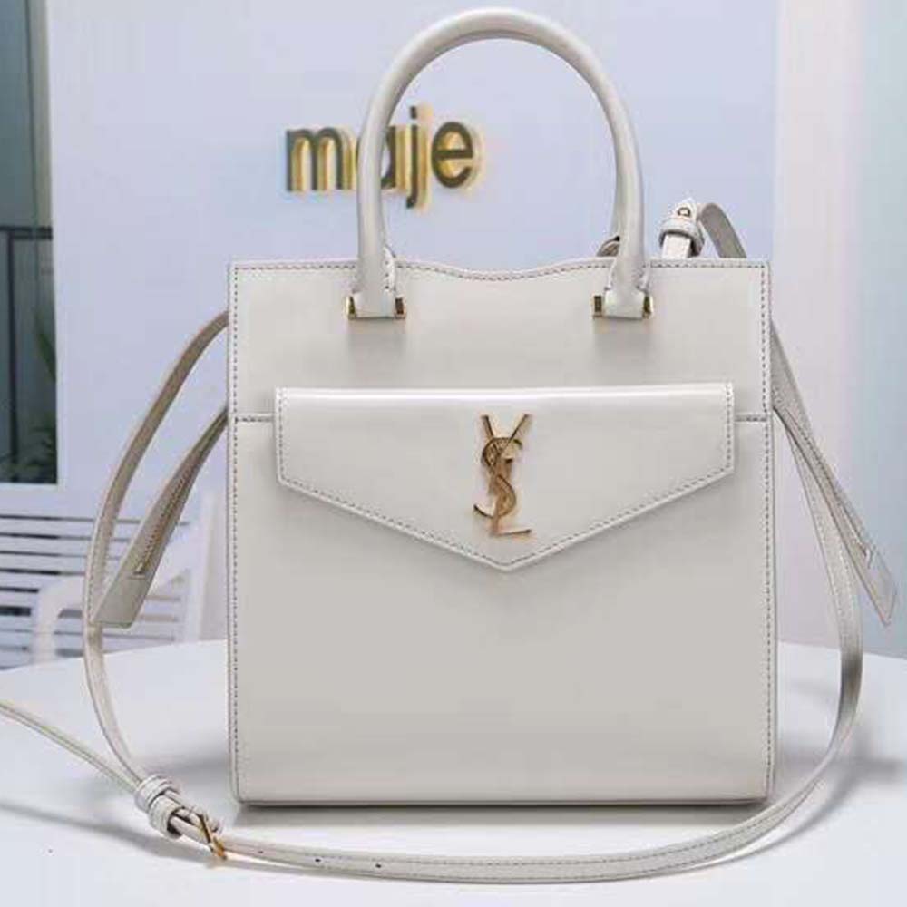 Close-up of gold YSL logo on Uptown Small Tote Shiny Smooth-White