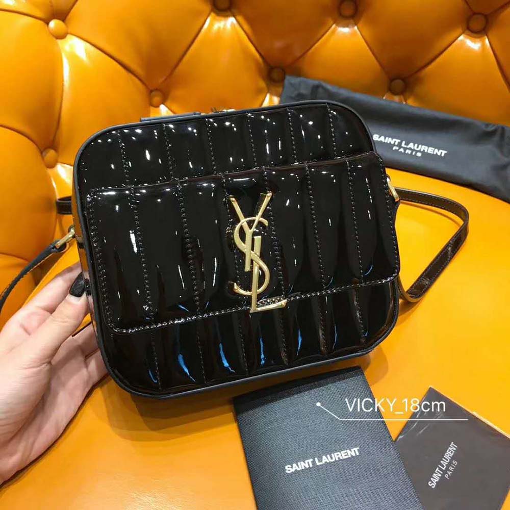 Side angle showing adjustable leather strap of Saint Laurent Vicky Bag