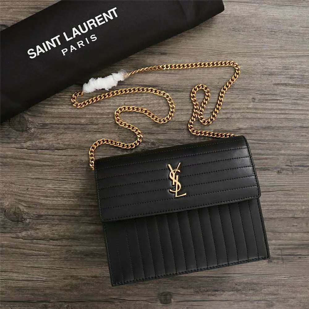 Close-up of gold-tone YSL chain strap on Victoire Chain Bag