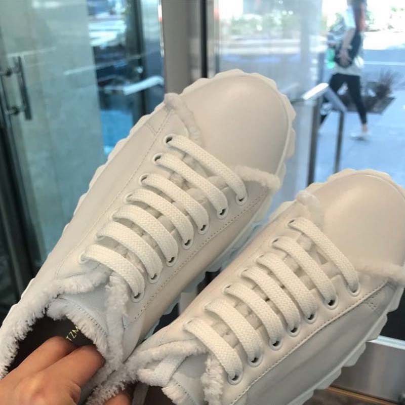 Close-up on fringe detail of Stuart Weitzman Women The Fringiecoverstory Sneaker
