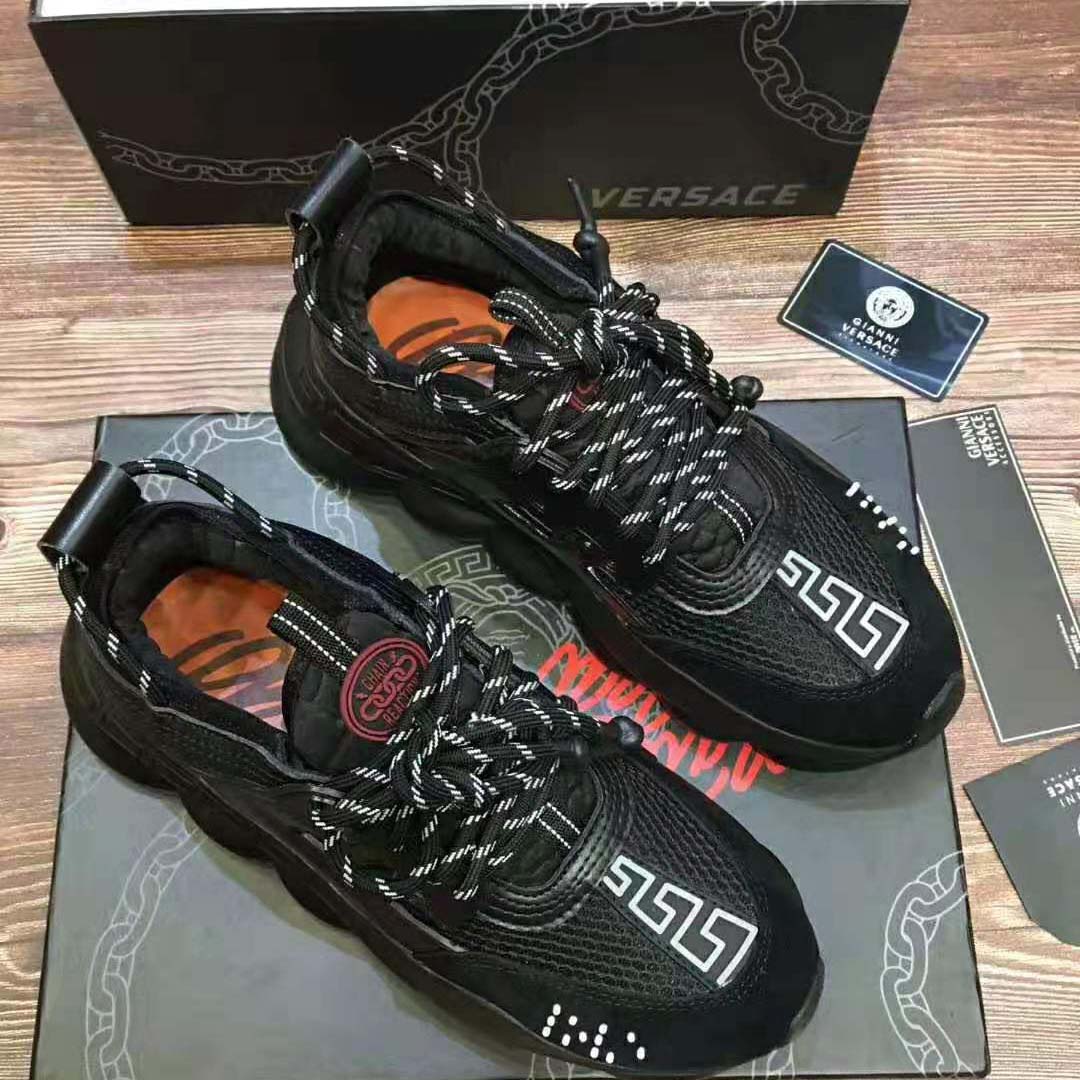Close-up of black leather and laces on Versace Men Chain Reaction Sneakers-Black