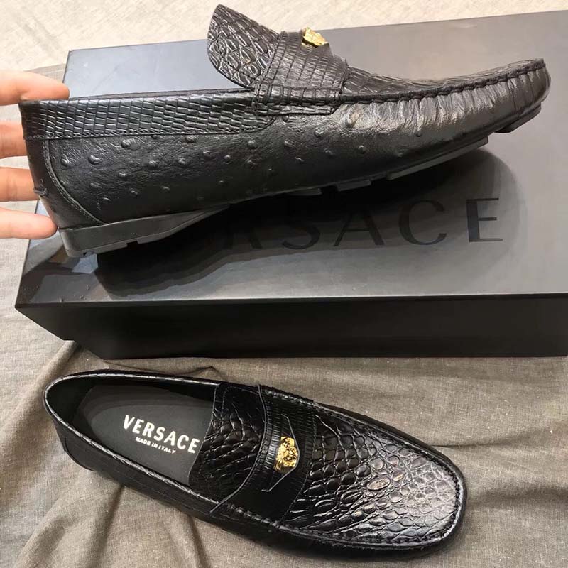 Close-up on gold Medusa detail of Versace Men Imola Moccasins