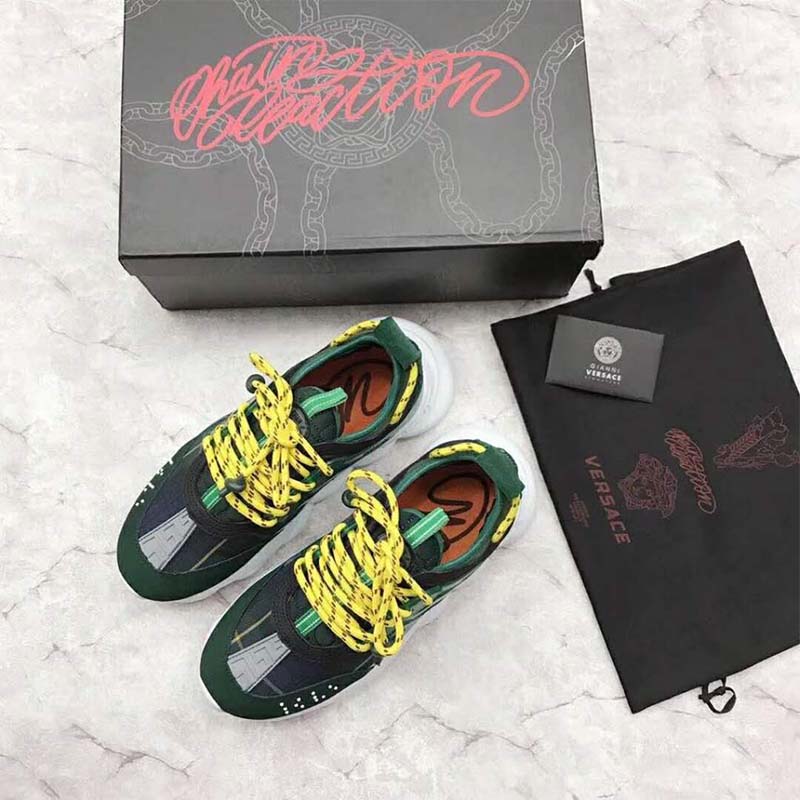 Top-down view of lace-up and tartan fabric on Versace Chain Reaction sneaker