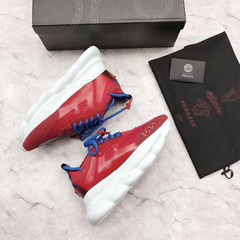 Close-up of red leather and chain-link sole on Versace sneakers