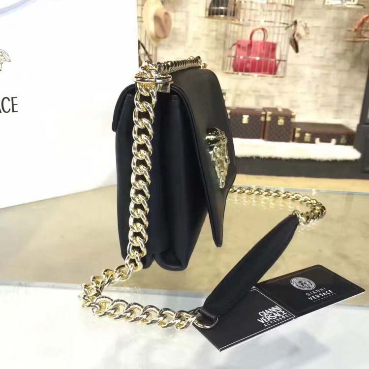 Side angle showing adjustable strap on Versace Palazzo Cross-Body Bag