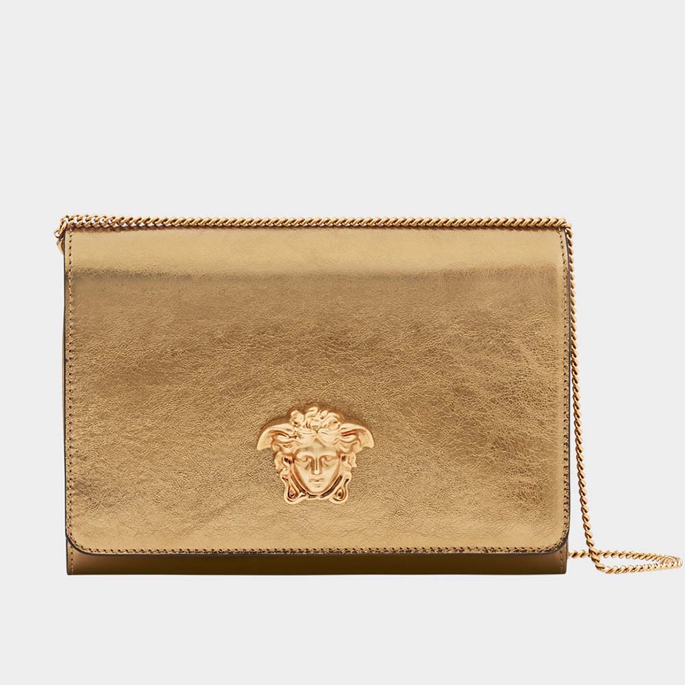 Front angle of Versace Women Laminated Palazzo Evening Bag in gold
