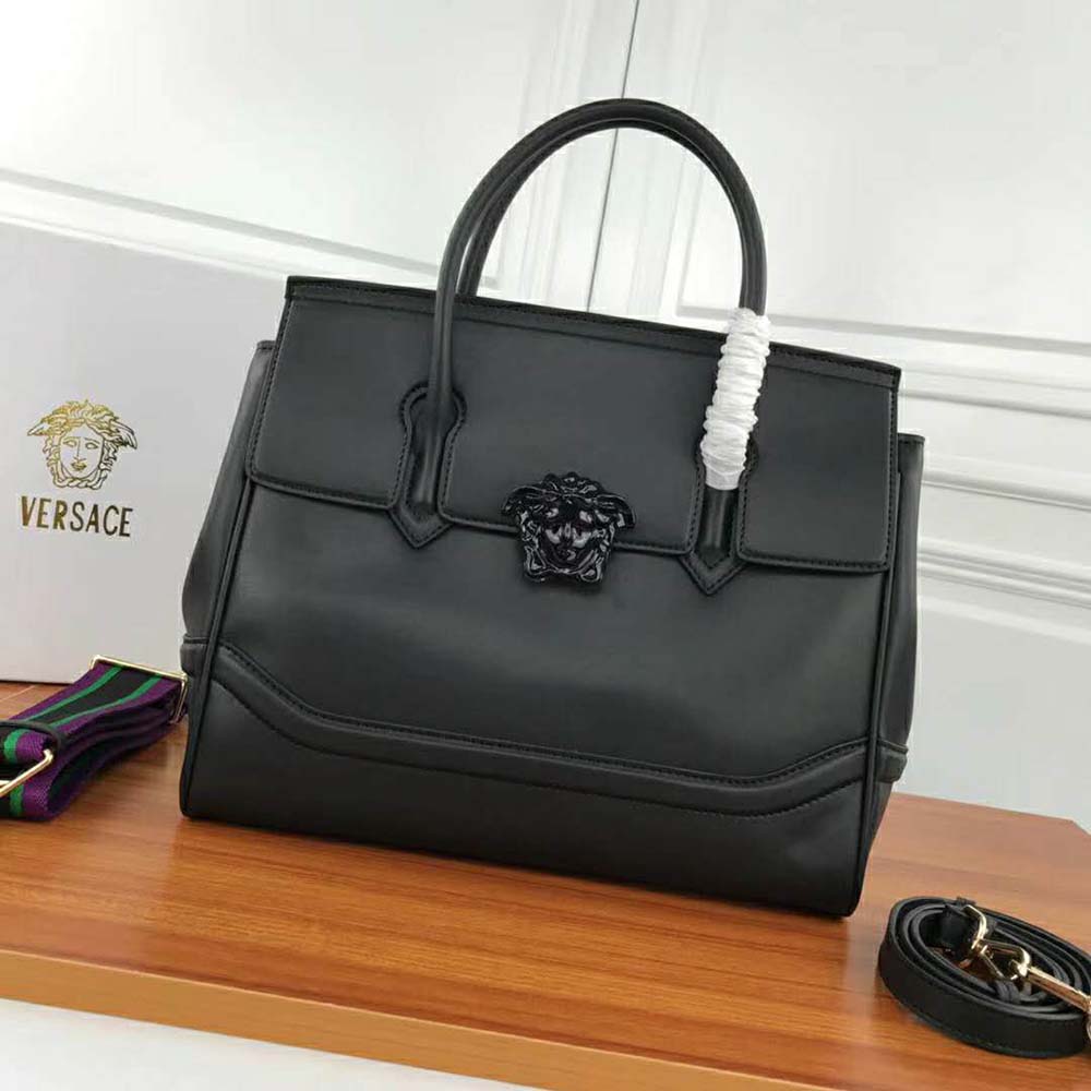 Close-up of gold Medusa hardware on Versace Women Palazzo Empire Large Bag-Black