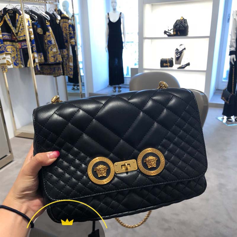 Close-up of gold Medusa hardware on Versace Women Quilted Icon Shoulder Bag