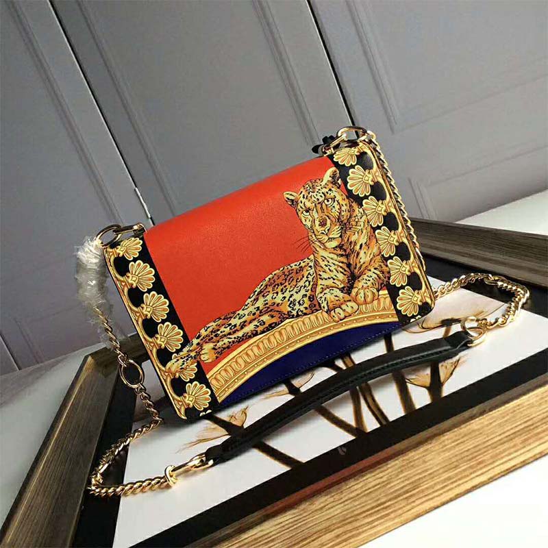 Side angle showing silhouette and flap closure of Versace Women Signature Pillow Talk