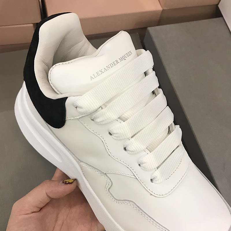 Close-up on leather texture and logo detail of Alexander McQueen Unisex Runner Shoes-White