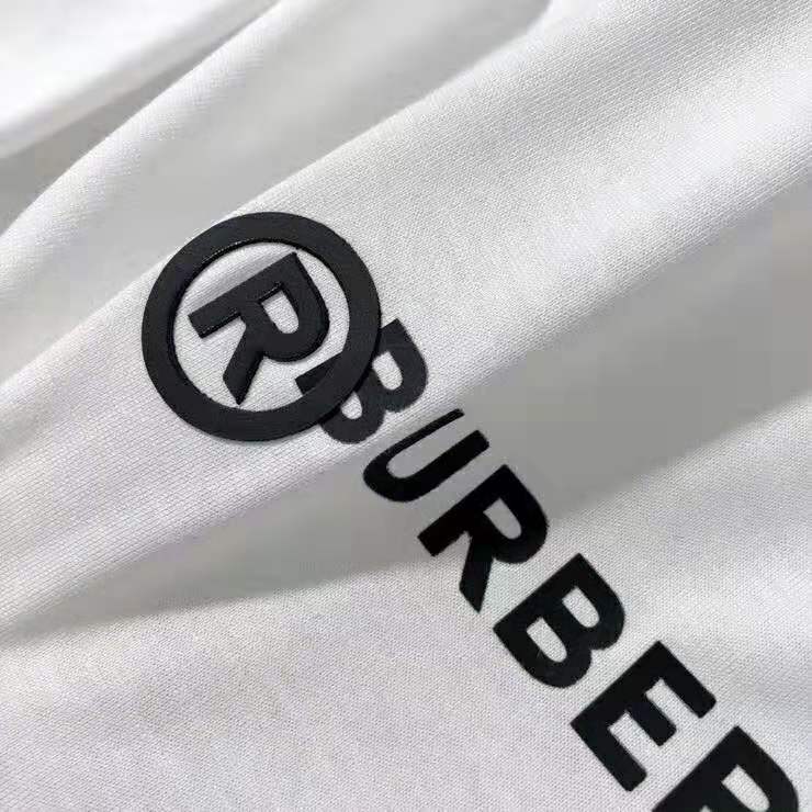 Side angle showing relaxed fit of Burberry Men Logo Print Cotton Oversized T-Shirt-White