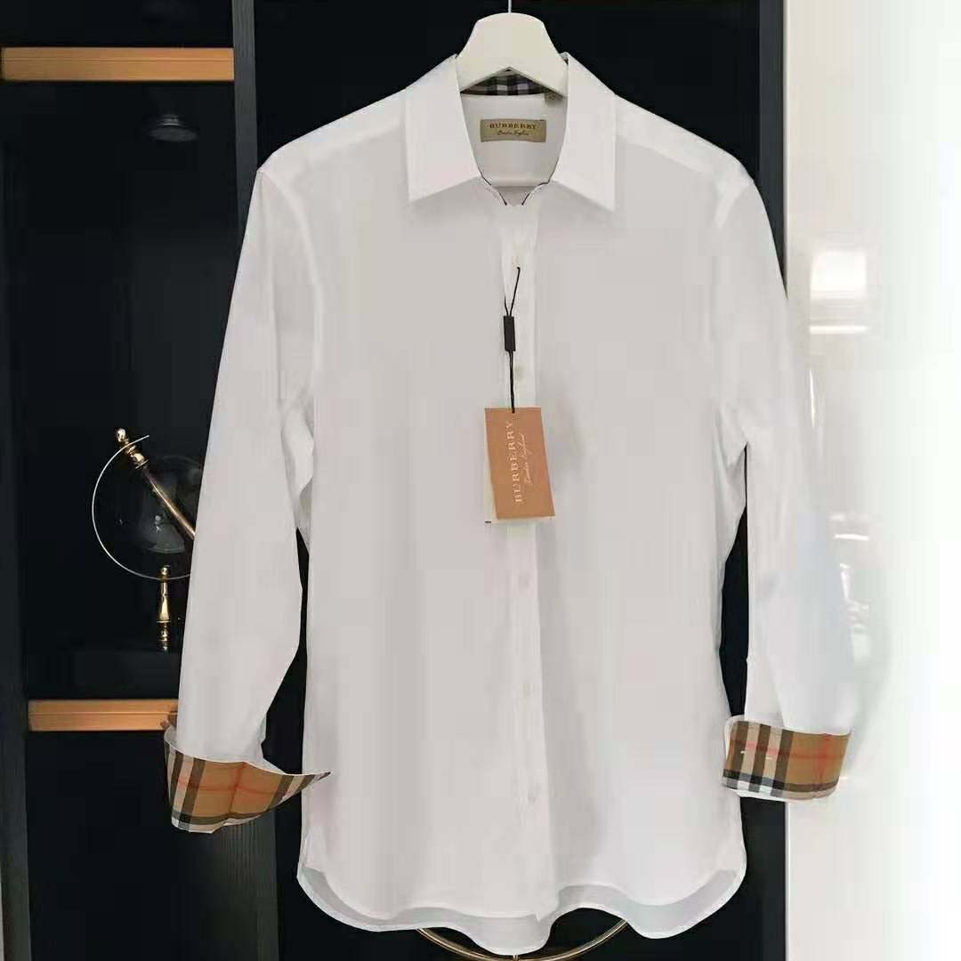 Close-up detail of Burberry check inside collar on white stretch cotton shirt
