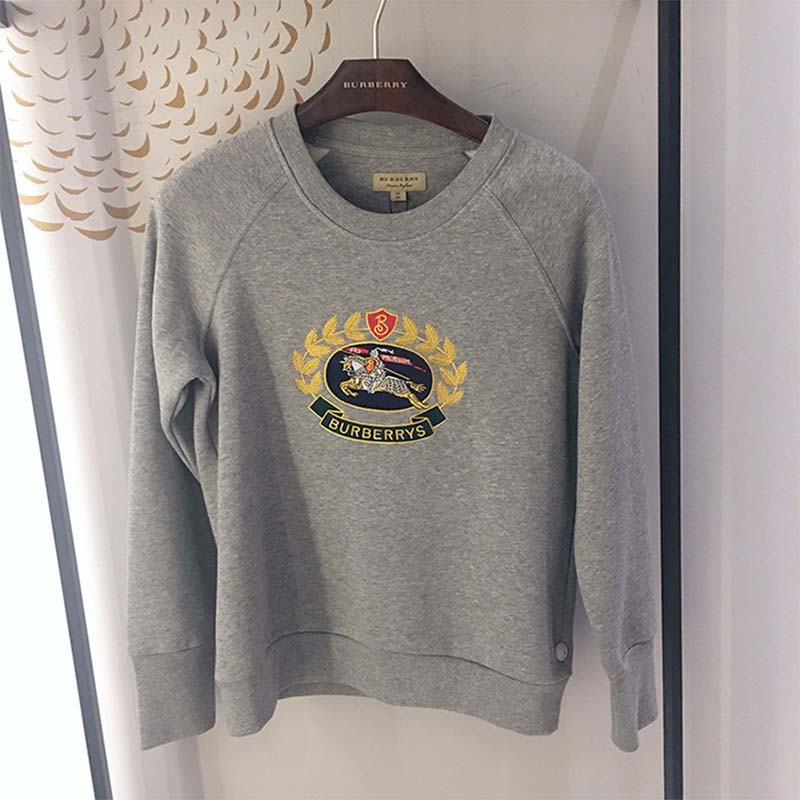 Close-up of embroidered archive logo on Burberry silver sweatshirt