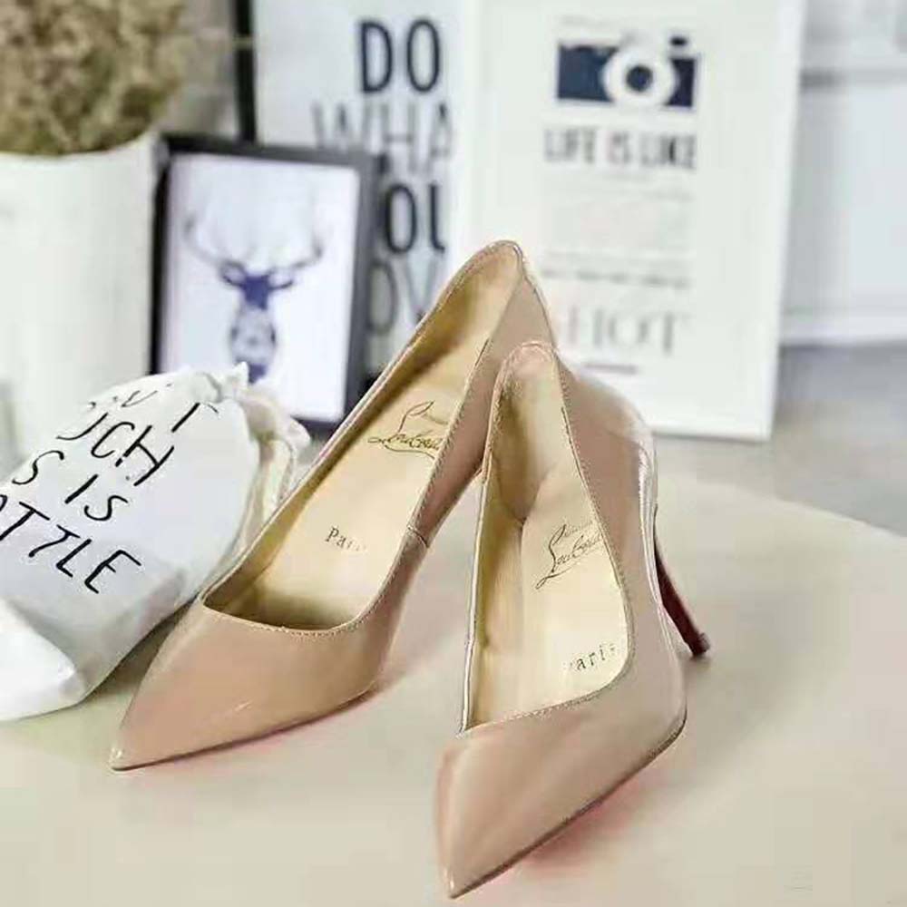 Close-up of signature red sole on Christian Louboutin Pigalle 85 mm Sandy heels