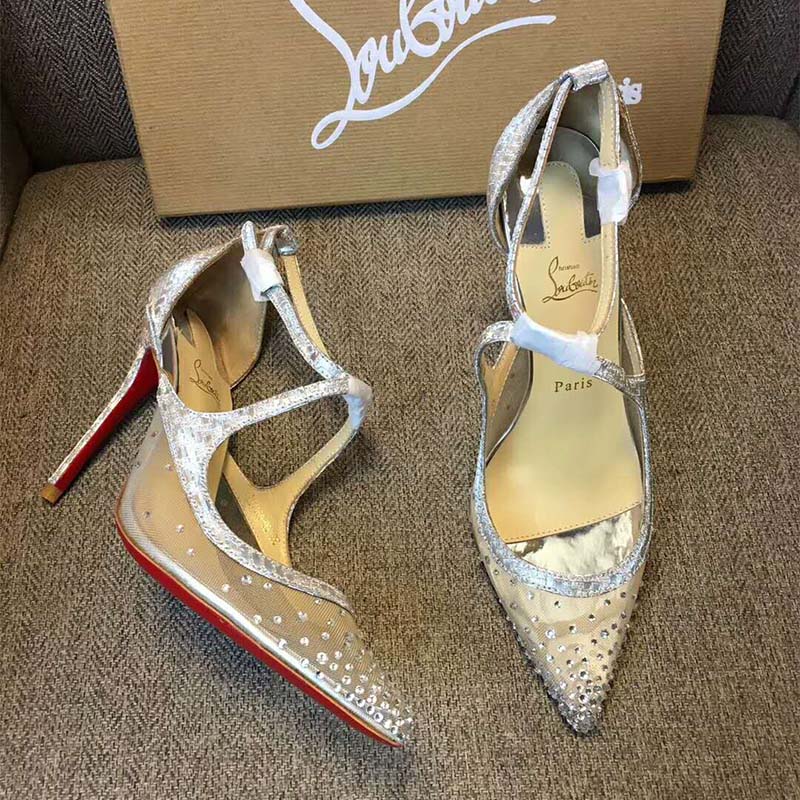Overhead shot highlighting silver leather and red sole of Twistissima Strass heels