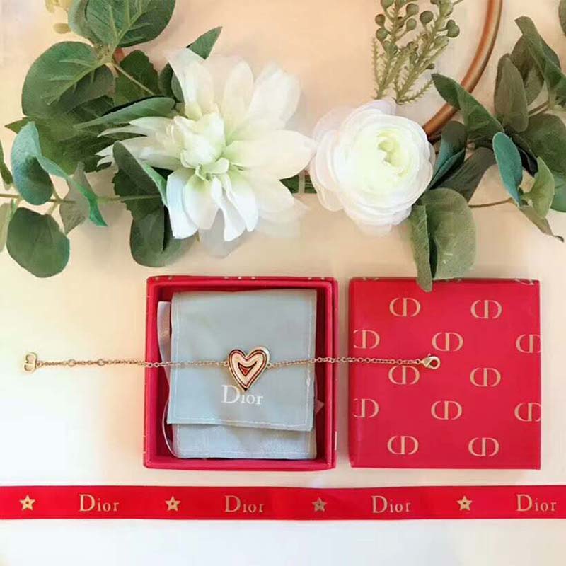 Styled wrist shot featuring Dior Women “Dioramour” Heart Bracelet glow