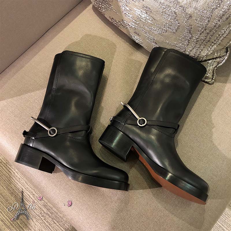 Close-up of black calfskin leather texture on Diorider Biker Boot