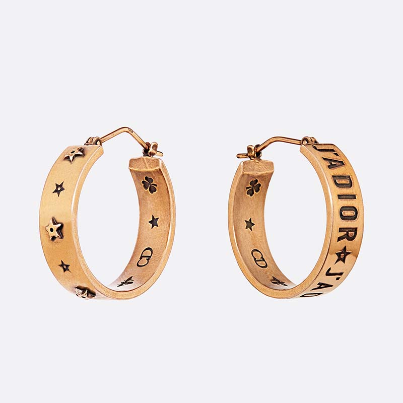 Close-up of Dior Women Tribales Asymmetric Earrings gold finish