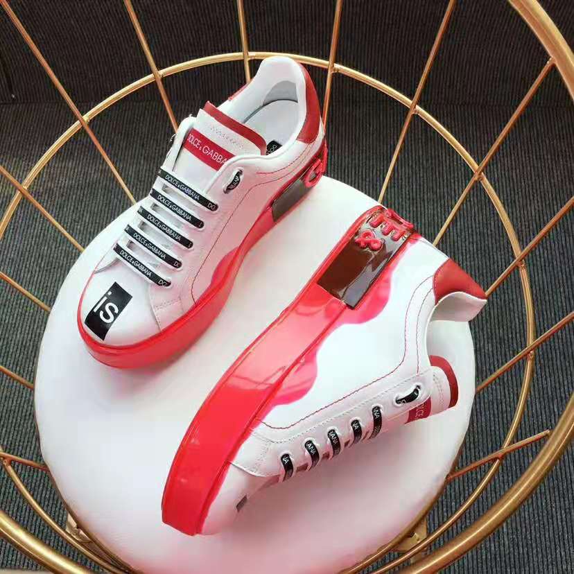 Close-up on lace closure and signature logo hardware on Dolce Gabbana D&G sneakers
