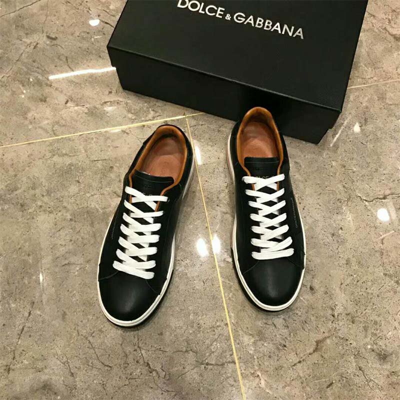 Close-up of lace closure and D&G metal accent on Roma Sneakers