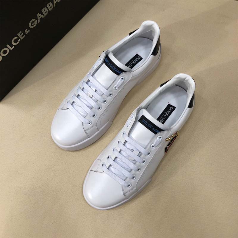 Close-up on designer patches of Dolce Gabbana D&G Calfskin Portofino Sneakers