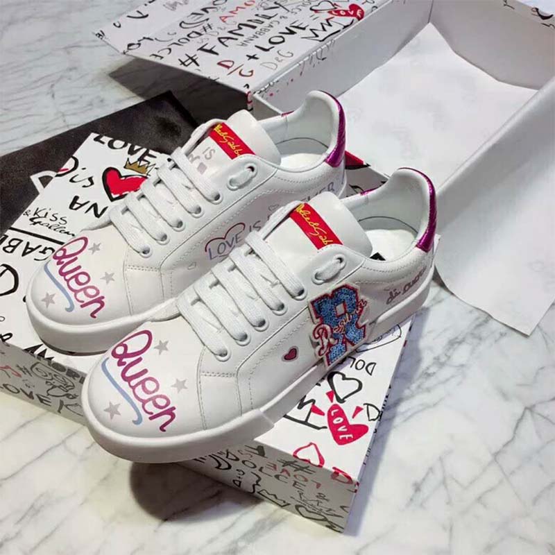 Top angle showcasing white lace-up and calfskin texture sneakers