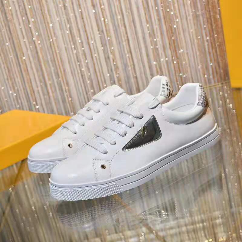 Close-up of embossed Fendi logo on white leather high-top sneaker